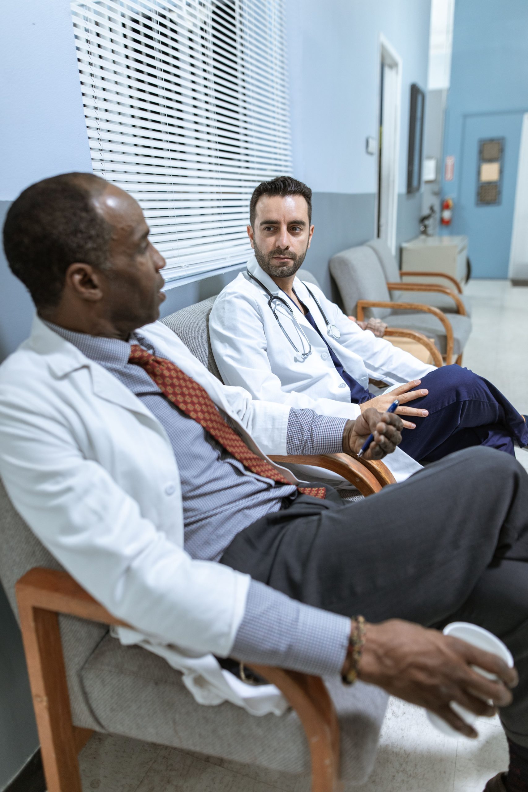 Photo by RDNE Stock project: https://www.pexels.com/photo/two-male-doctors-talking-with-each-other-6129455/